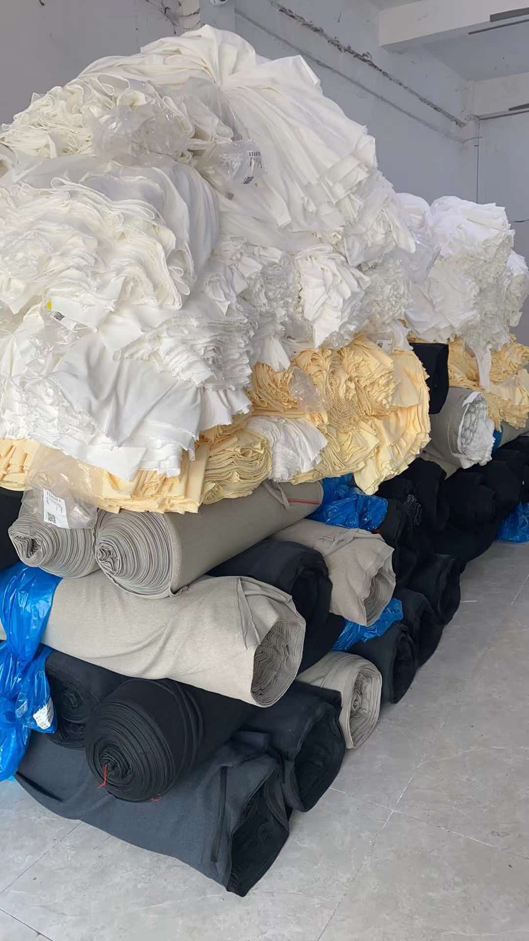 Fabric rolls and prepared stock inside the Guangzhou production location