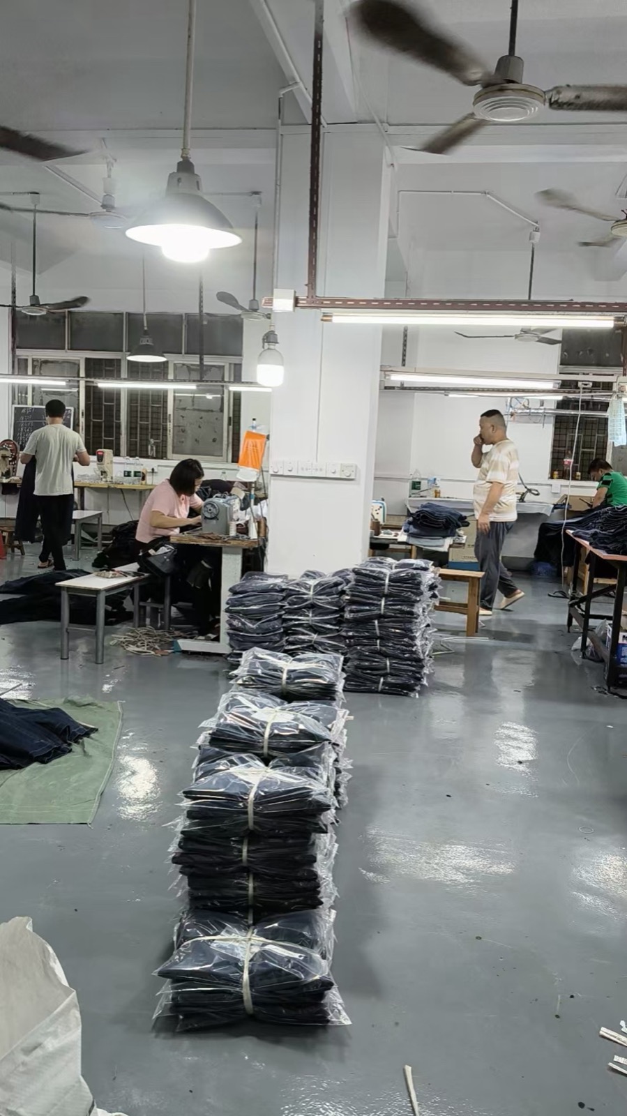 Finished women’s jeans arranged inside the GD DENIM production location in Guangzhou